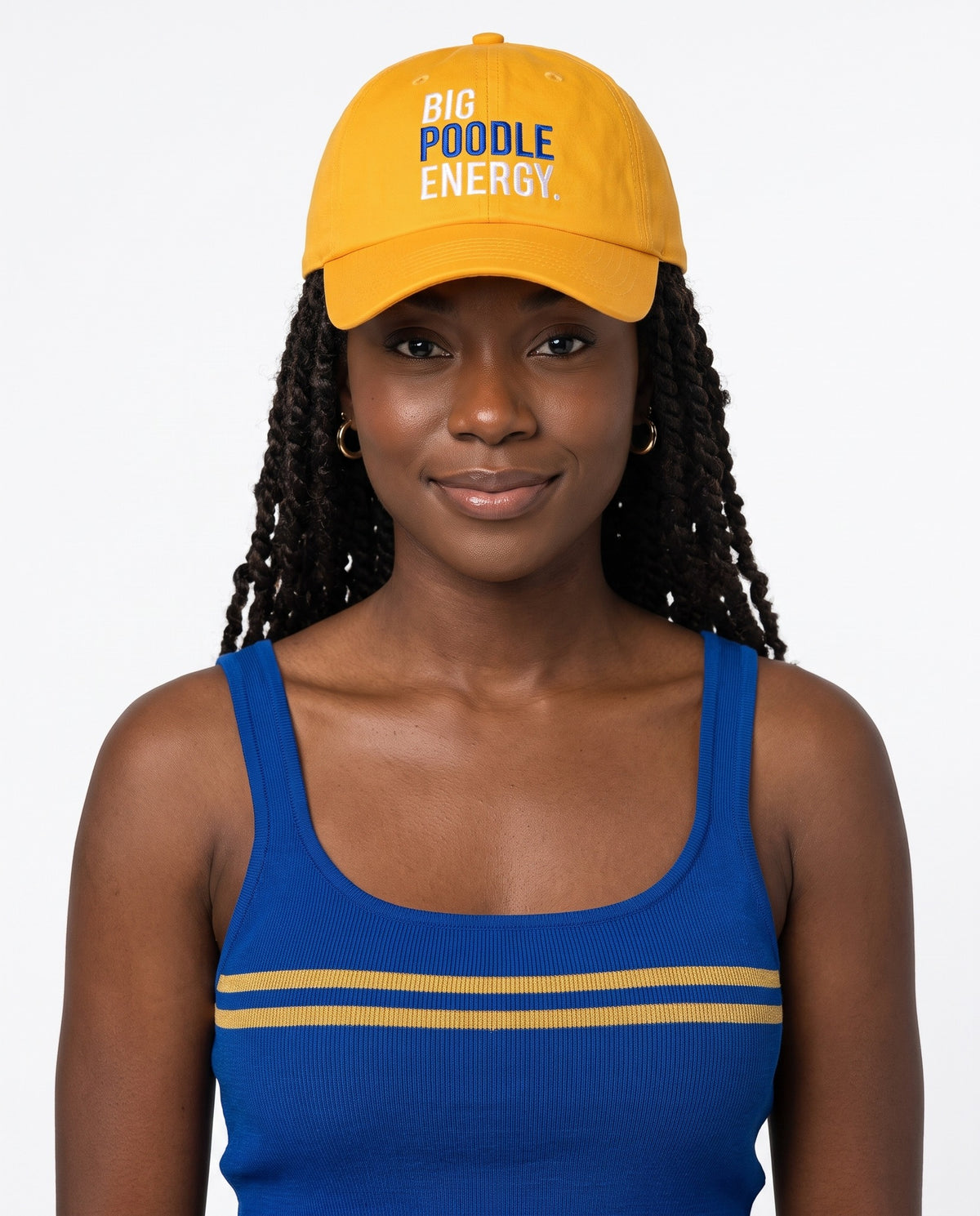 Big Poodle Energy Hat in gold, worn front on, Poodle in royal blue